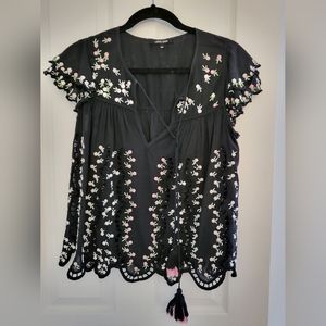 Black floral ruffled shirt with cutouts